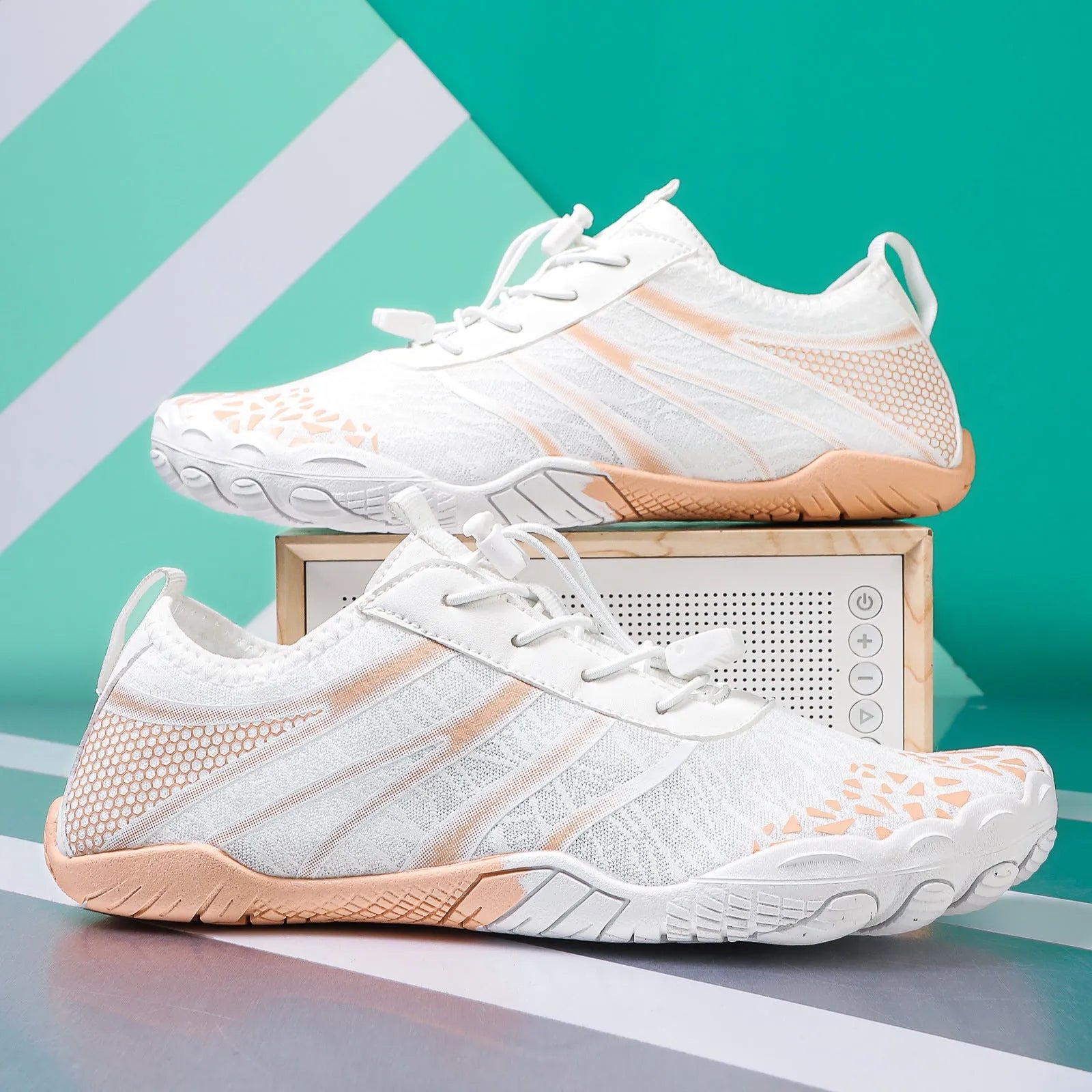 Lycra stretch fabric casual running shoes for men and women on a beach background.
