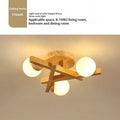Wooden style three-head ceiling light with Nordic modern design and neutral lighting