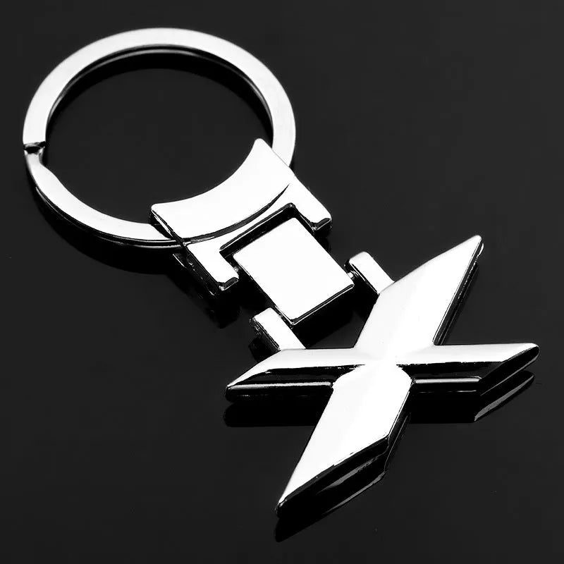 Zinc alloy metal keychain 67mm long on a wooden surface with a set of keys attached