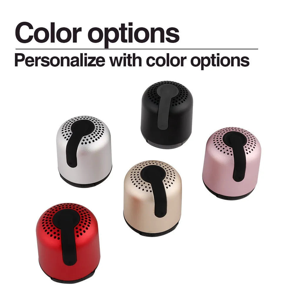 Hieha XQ11 cylinder-shaped mini Bluetooth speaker in silver colour on a table