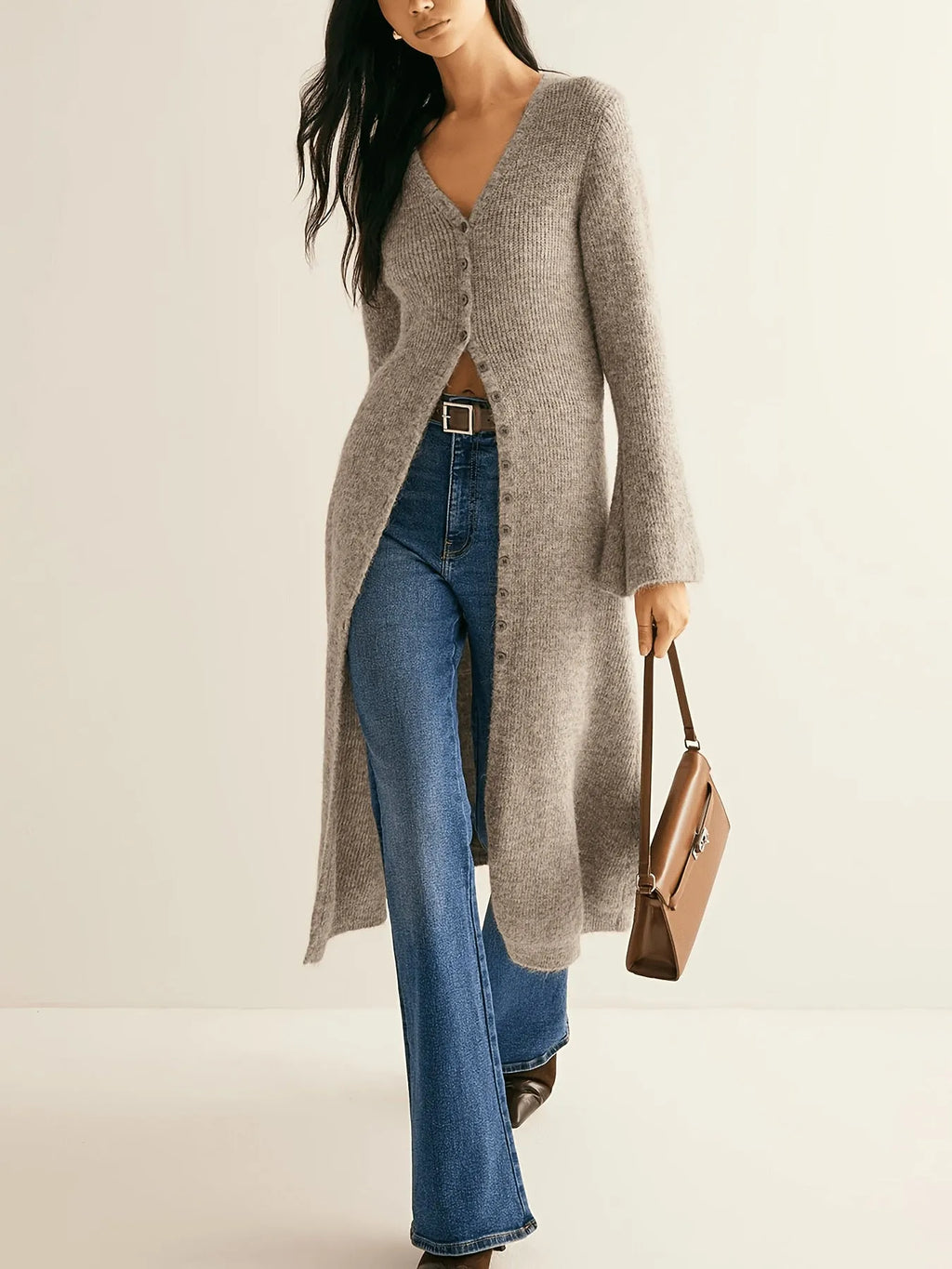 Khaki French retro long sleeve cardigan with button front on a model.