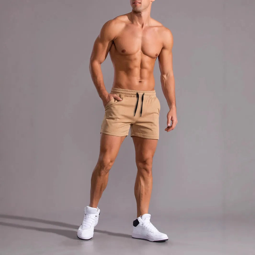 Set of three men's solid colour casual shorts with drawstring waists in black, khaki and light brown