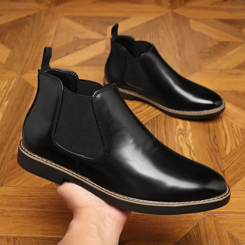 Black and brown formal men's pointed-toe leather boots with a square rubber heel.