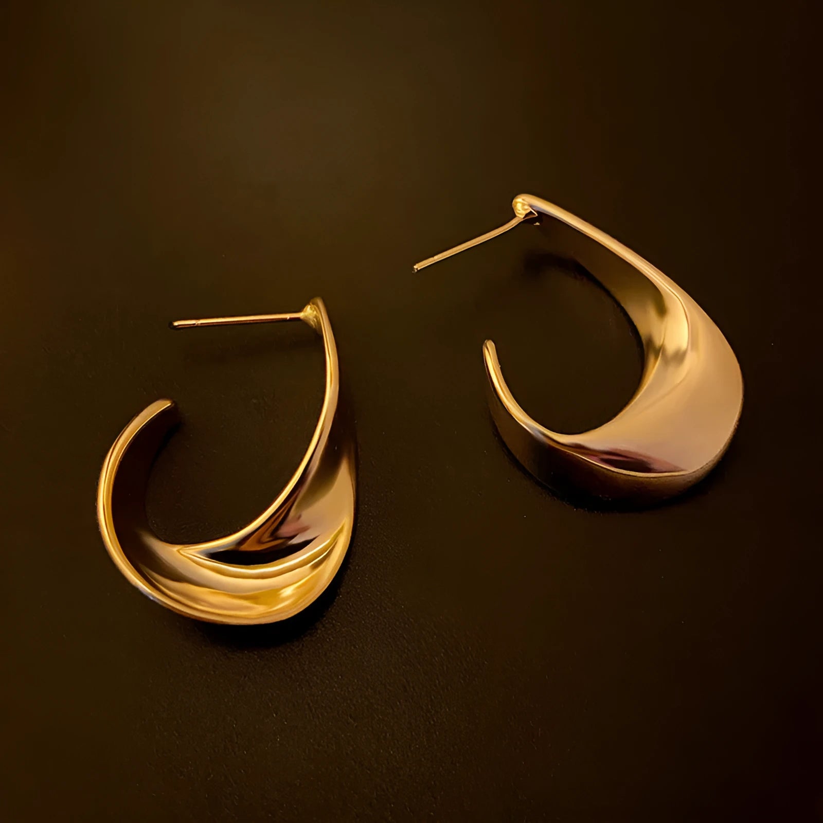 Geometric twisted metal earrings in gold or silver electroplated finish