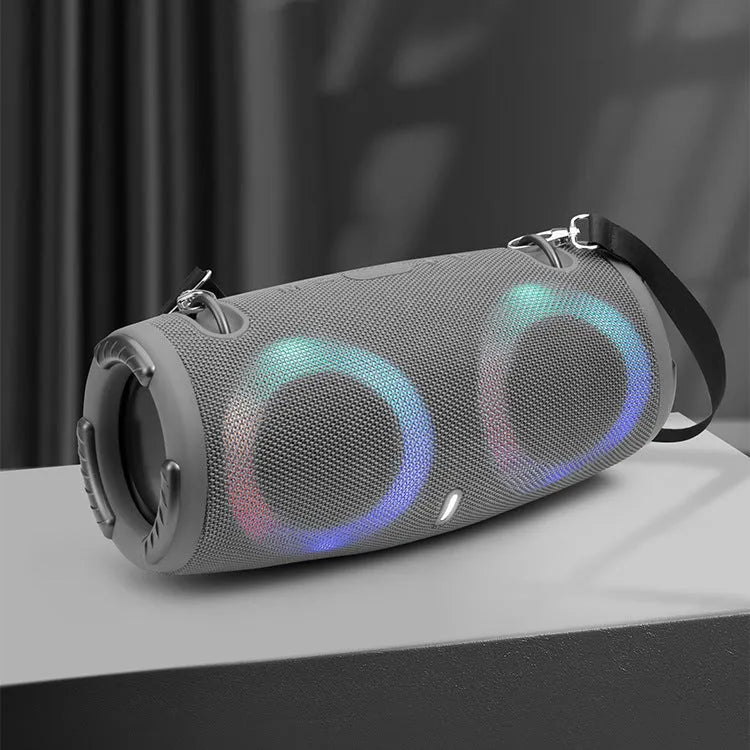 Round portable Bluetooth speaker with RGB coloured lights in camouflage colour option with carrying strap