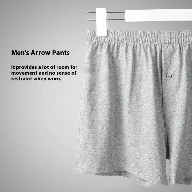 Men's solid-colour cotton boxer shorts with a high-waist, loose fit on a neutral background.