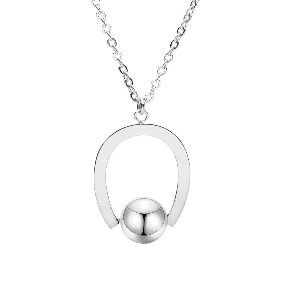 Stainless steel geometric pendant necklace on cross chain in gold or silver finish