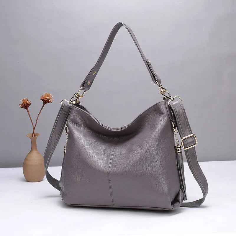 Genuine leather vertical square crossbody bag showing internal phone and document pockets