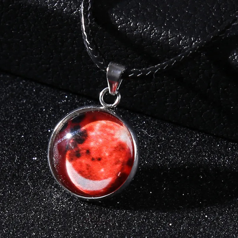 Luminous moon and constellation design pendant on an alloy necklace chain with extension.