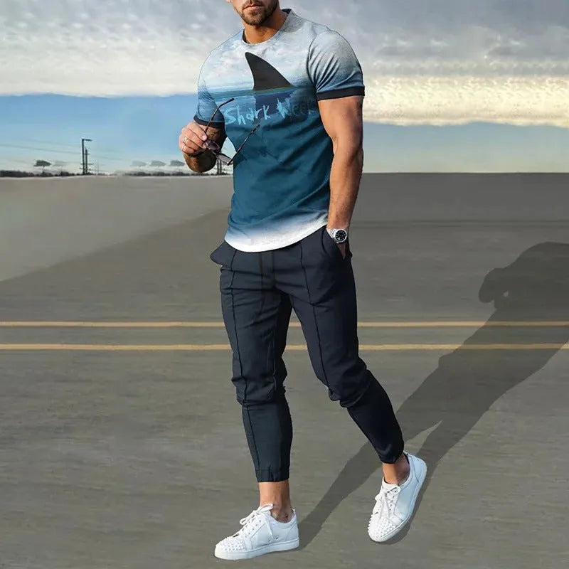 Man wearing a short-sleeved printed round neck pullover and matching trousers from a lightweight athletic suit set.