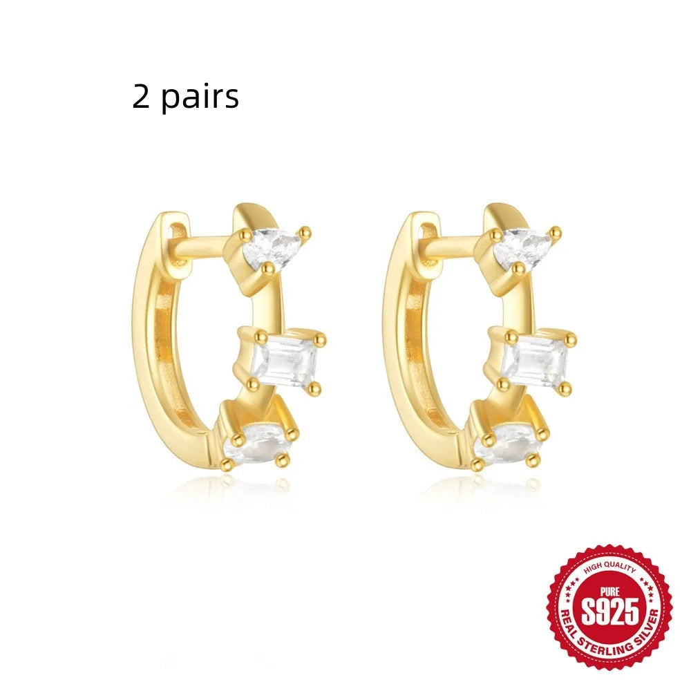 Sterling silver geometric stud earrings with diamond detailing in gold or silver finish