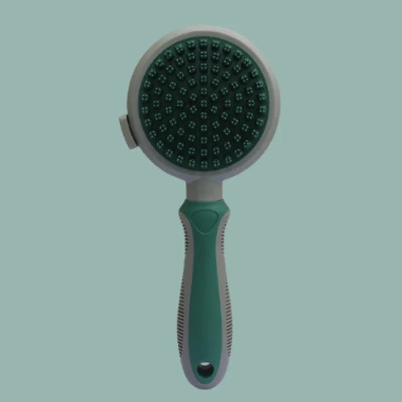 Green and pink 2-in-1 silicone cat grooming brush showing slicker brush and massage heads