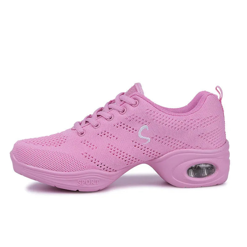 Women's white breathable flyknit mesh dancing shoes with a soft PU sole on a light background.