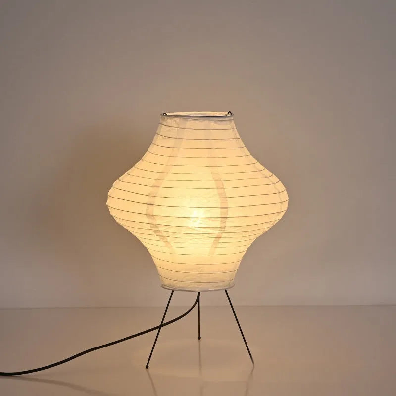 Japanese-style Xuan paper table lamp with a white shade on a wooden base.