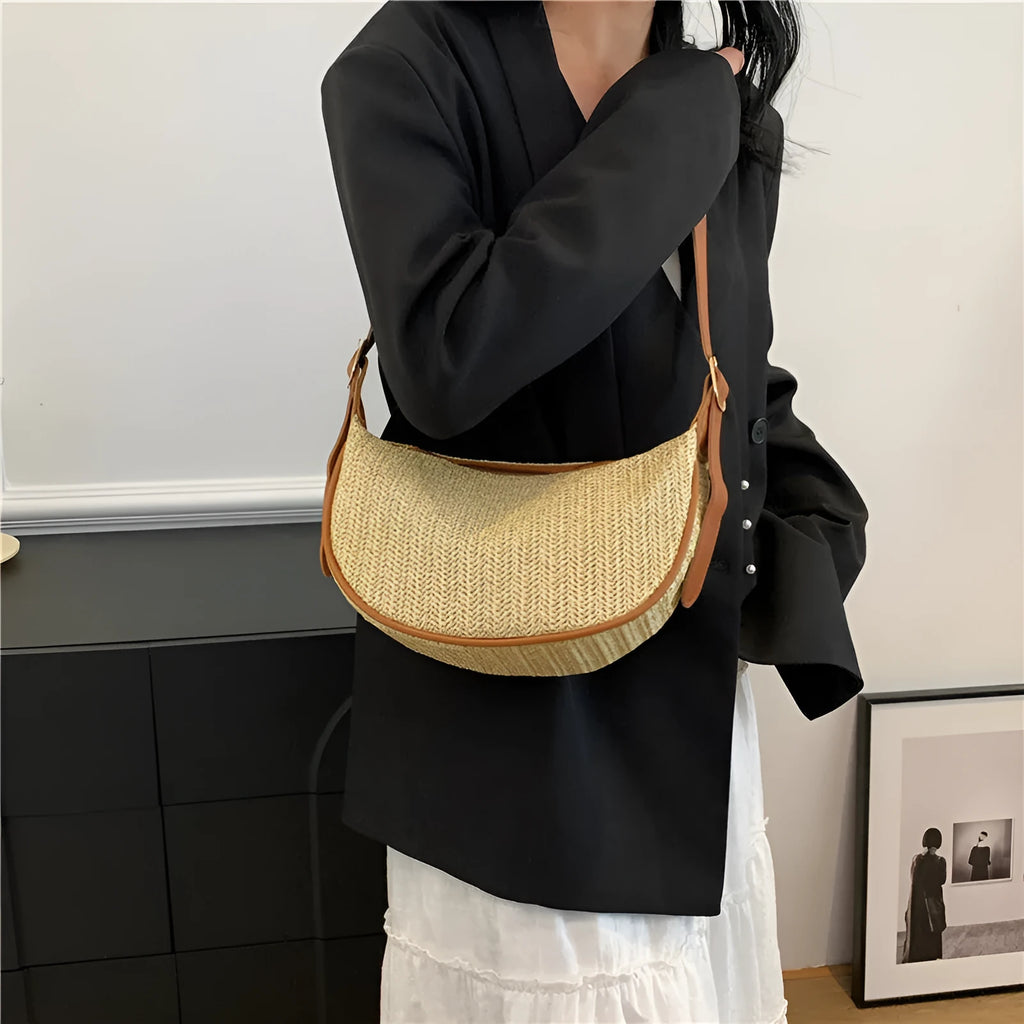 Women's straw woven crossbody bag with internal phone and document pockets in corrugated finish