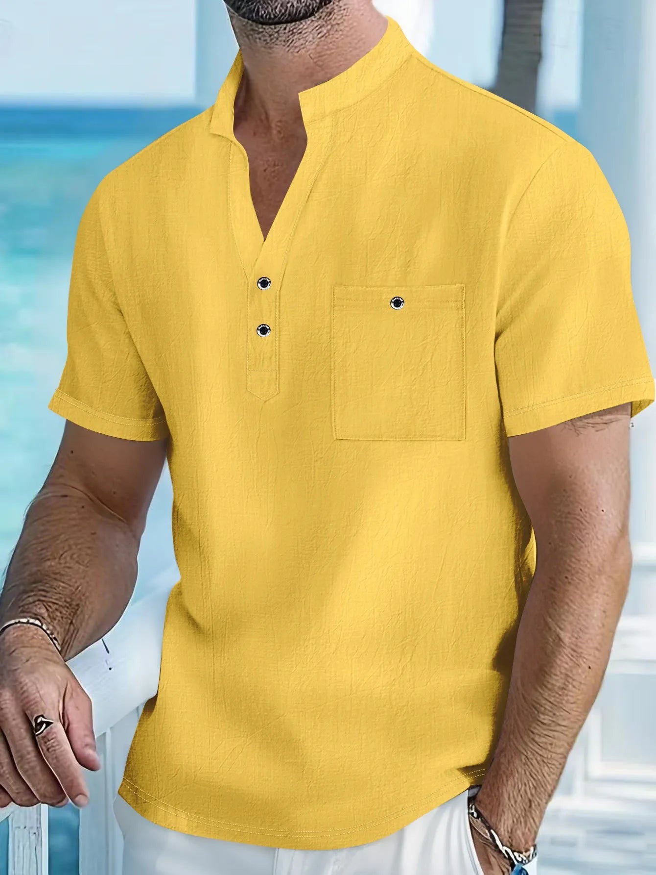Man wearing a light blue linen-blend stand collar T-shirt with short sleeves and a loose fit.