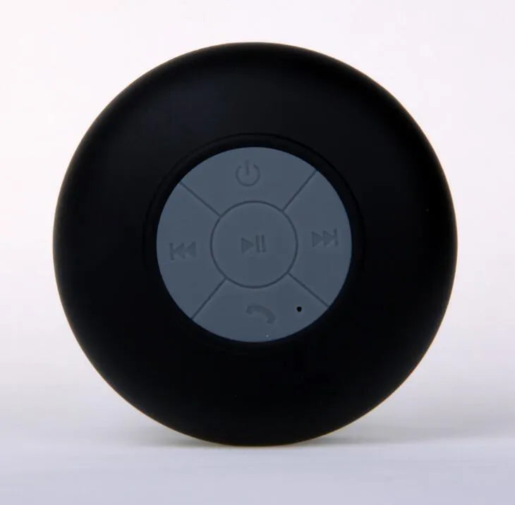 Portable Bluetooth speaker with suction cup showing front speaker grille and side buttons