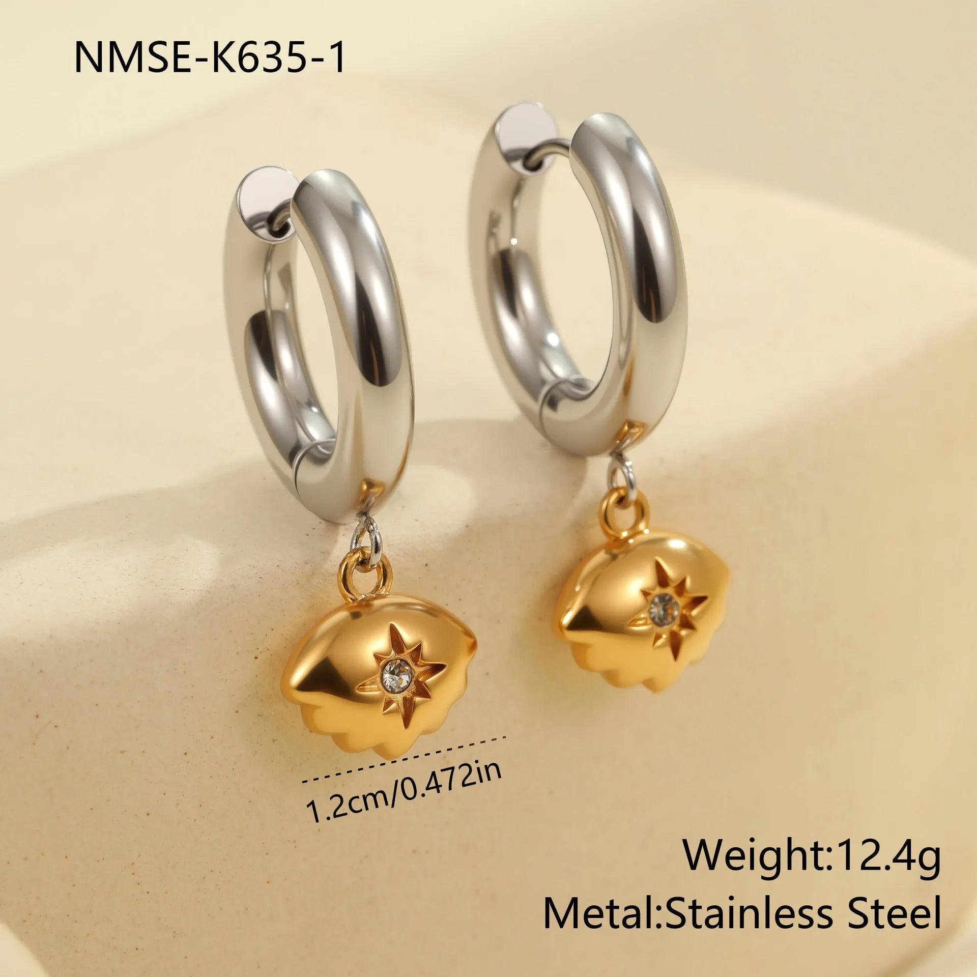 A pair of stainless steel earrings with an 18K gold colour finish, shown in a Christmas tree shape and a heart shape.