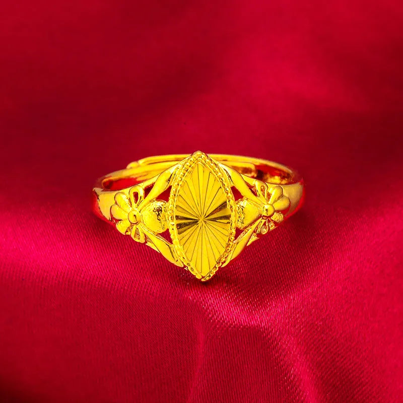 Alluvial gold tone open diamond flower ring with geometric design and textured surface