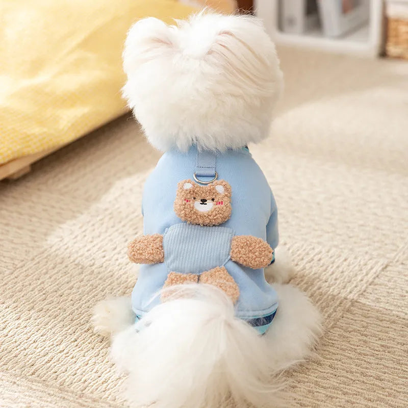 Soft navy blue dog sweater with light blue striped cuffs and blush bear decorations