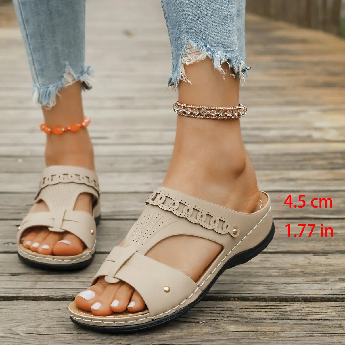 A pair of slope heel Roman style slippers with a fish mouth toe holder, shown in one of six available colours.