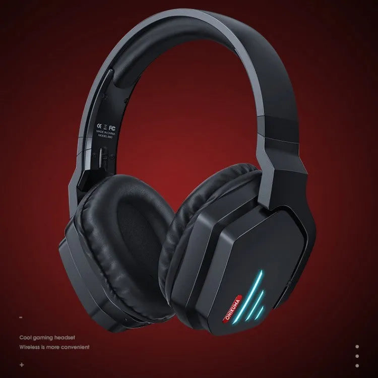 Luminous black wireless gaming headphones with head-mounted design showing ear cups and included 3.5mm cable