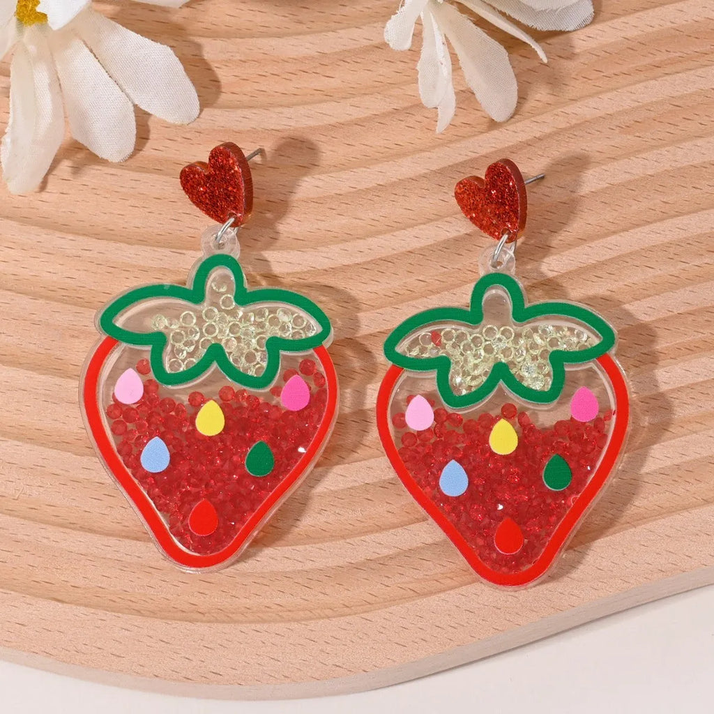 Colourful acrylic novelty earrings shaped like fruits and desserts including cherry, strawberry, and ice cream.