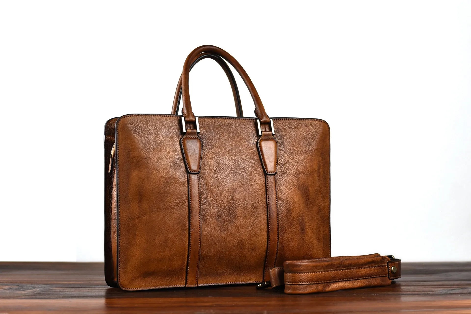 Men's brown leather business handbag with horizontal square design and zipper closure