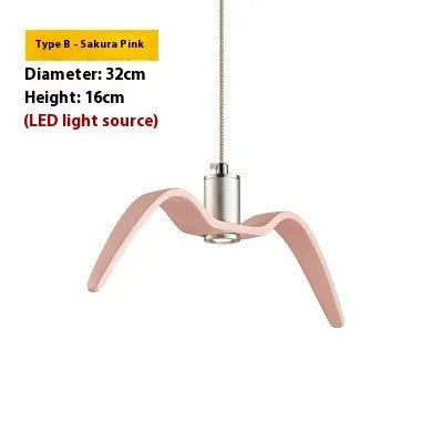 Nordic style ceiling chandelier with macaron colour options shown in a dining room setting.