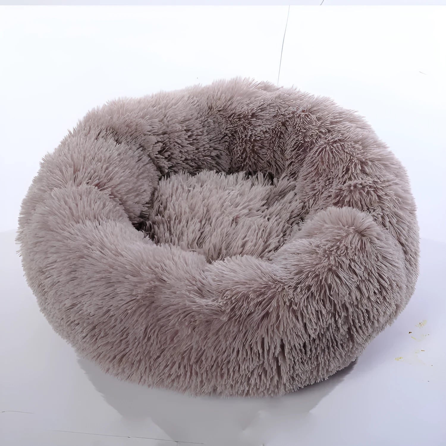 Plush pet nest in apricot colour on floor, soft cloth circular dog bed 40cm diameter indoor use