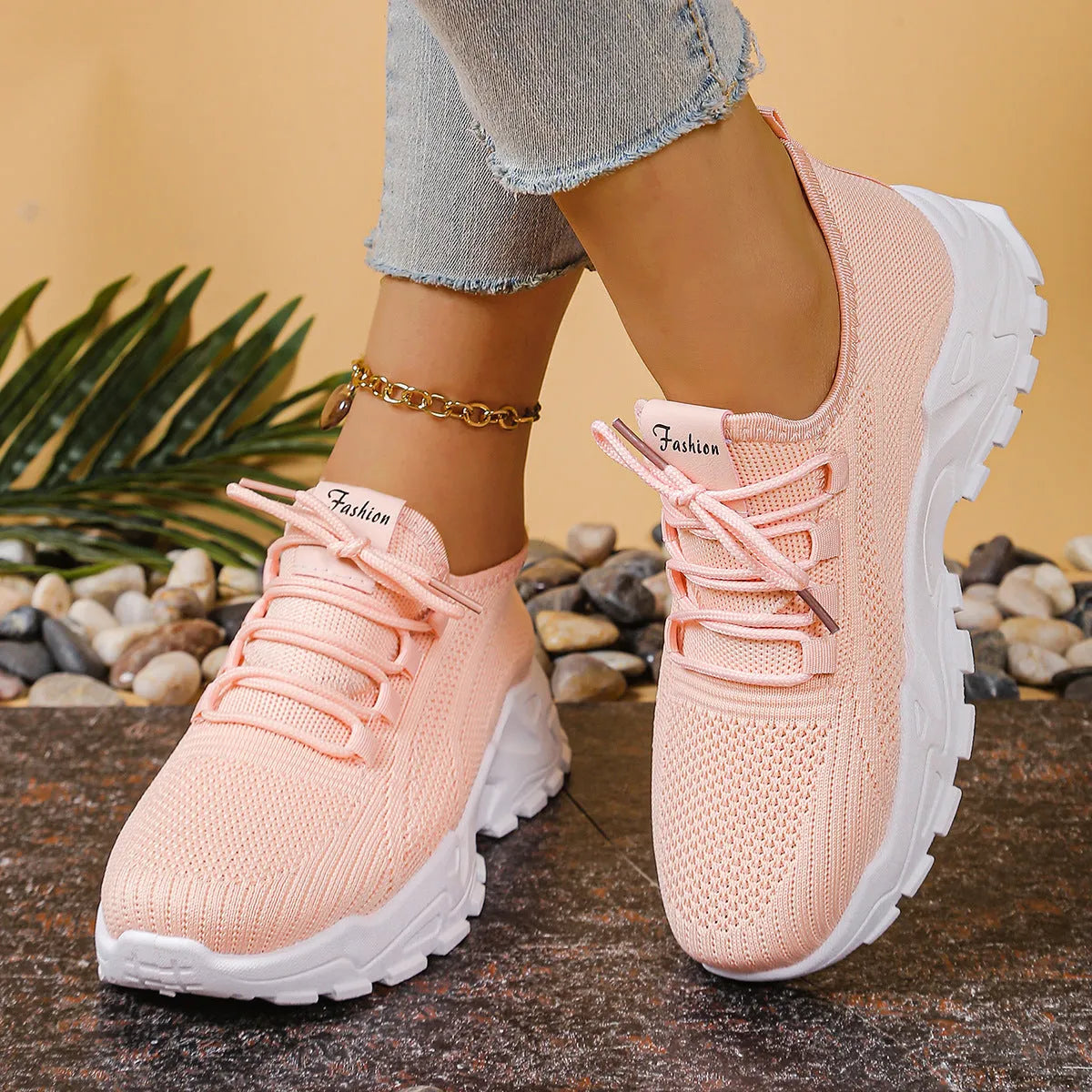 Women's low-top sneakers with mesh upper and platform sole in various colours.