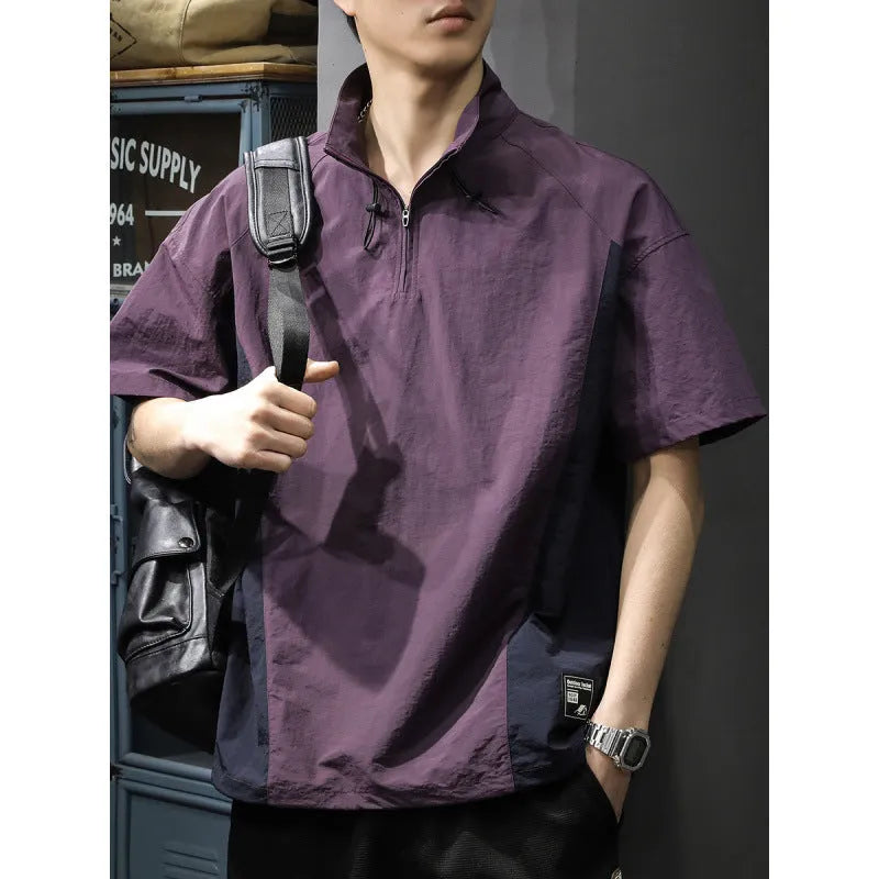 Brown men's half-zip stand collar short sleeve casual shirt laid flat, showing fleece lining and loose fit.
