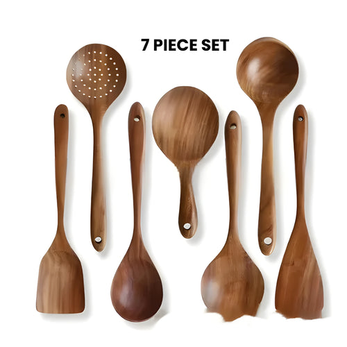 Boxed set of seven wooden kitchen utensils including cooking spoons, a spatula, and soup spoons.