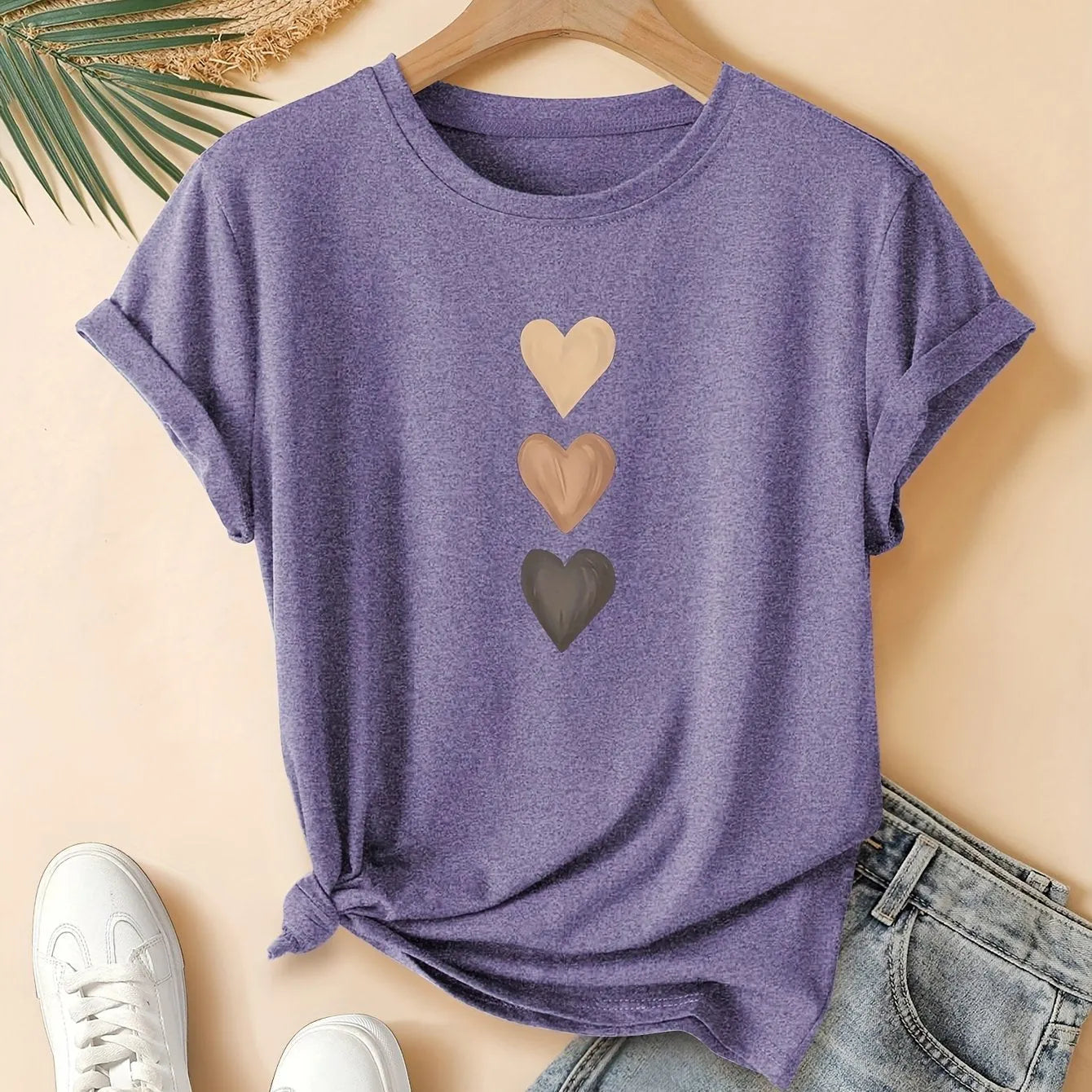 Women's art retro style printed cotton short sleeve T-shirt on a hanger.