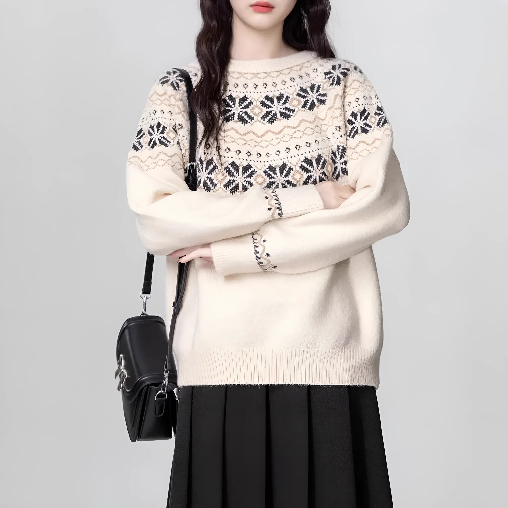 Women's loose-fit Fair Isle pullover sweater with white geometric knit pattern, crew neck, and long sleeves.