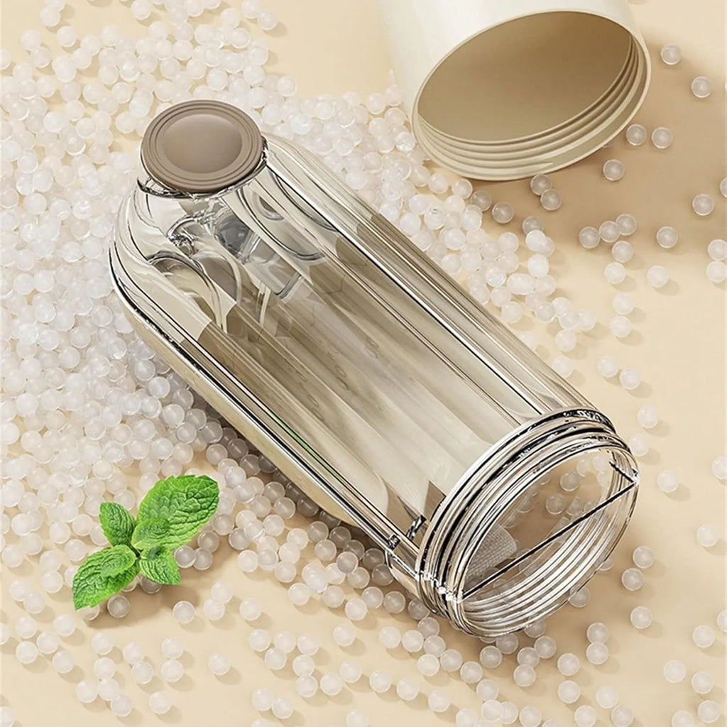 Beige foldable dog water bottle with food container, showing dispenser tray and compact size.