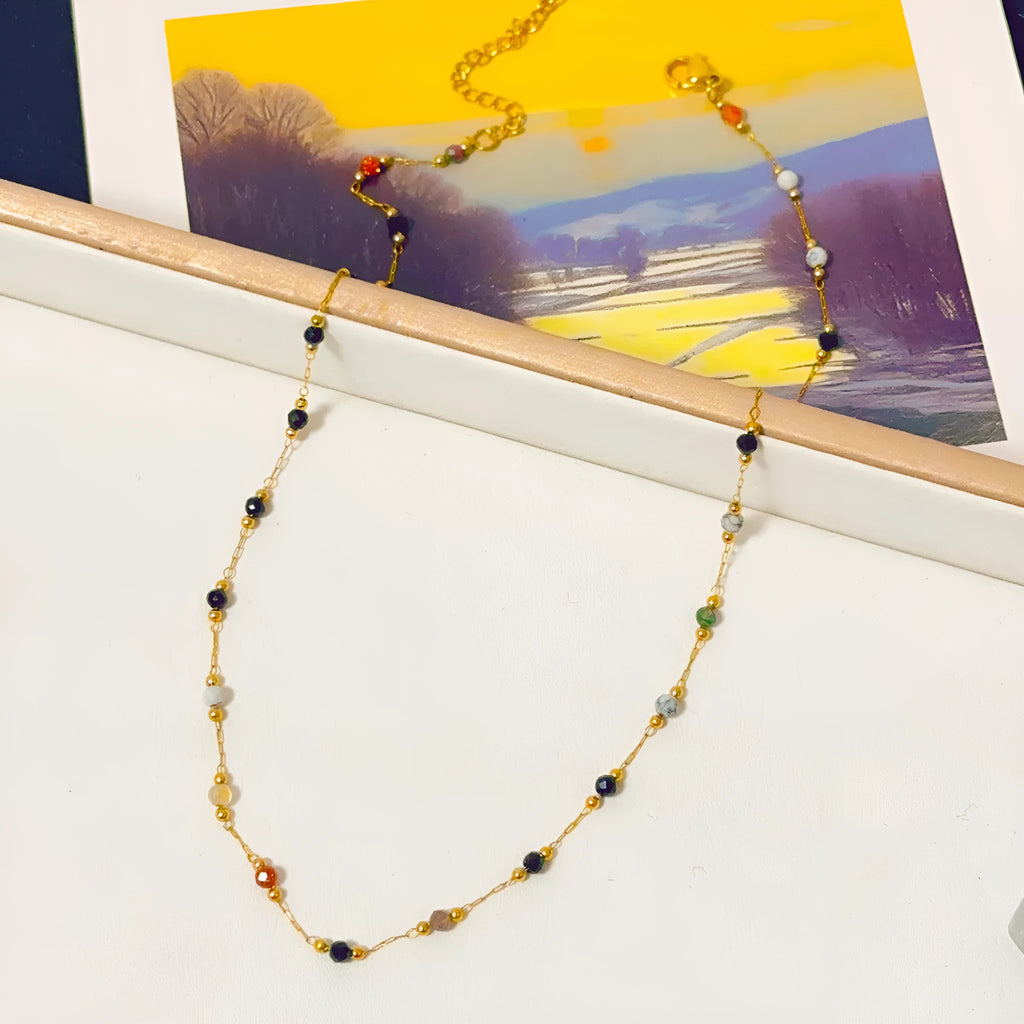 Gold titanium steel necklace with natural stone pendant showing O-ring chain and retro simple design