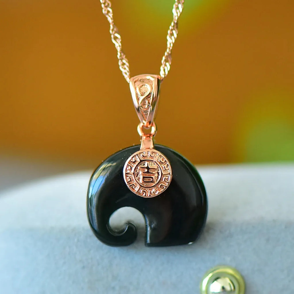 Flat natural Hetian Jade pendant with copper inlay design on a necklace chain