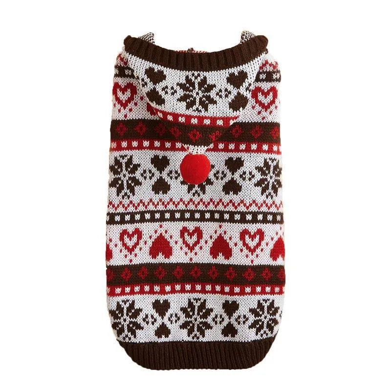 Pink knitted dog jumper with snowflake, love heart, and striped camouflage pattern on a small white dog.