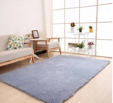 Solid colour plush area rug with non-slip dot-patterned bottom in rectangular shape