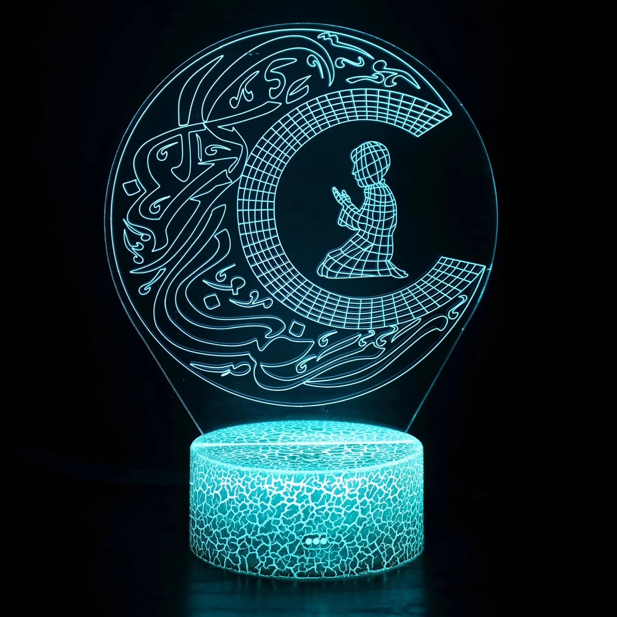 3D small night lamp with LED colourful lighting and black base on bedside table