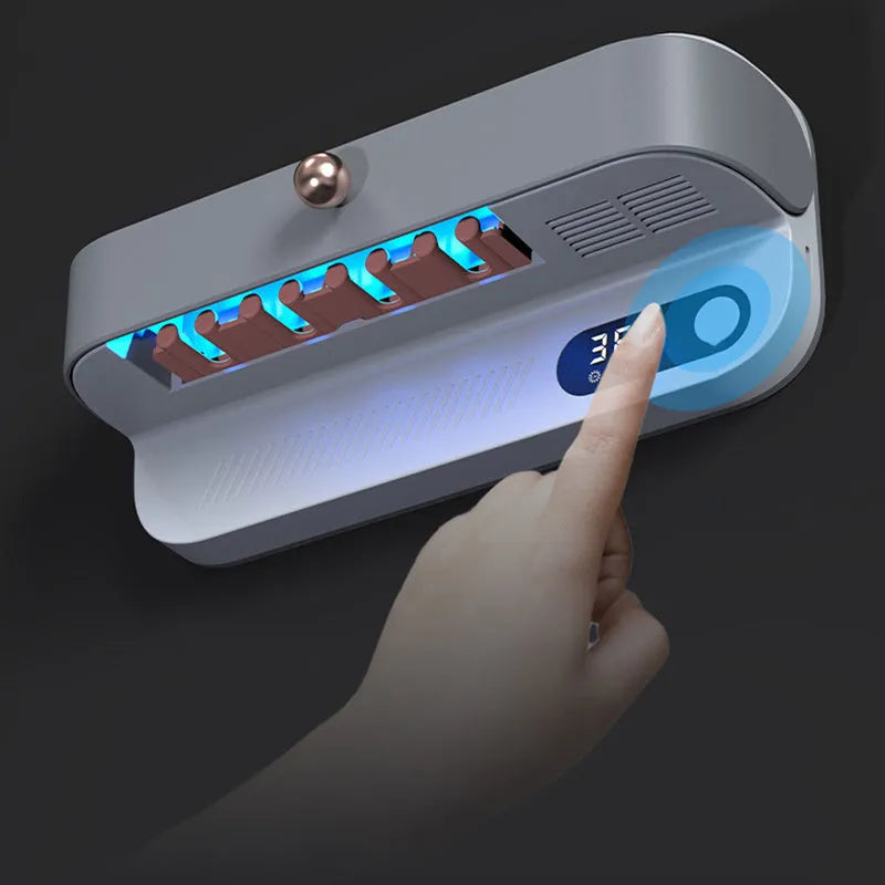 White wall-mounted smart toothbrush steriliser unit with UV disinfection and USB charging port.