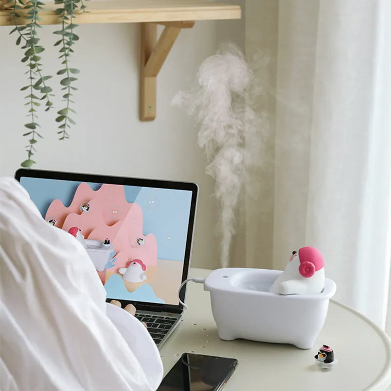 White USB air humidifier and aromatherapy diffuser with large water tank on a desk