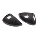 Black true carbon fibre rearview mirror cover for Porsche Macan on a white background