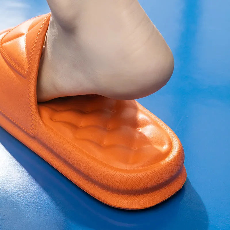 A pair of soft EVA bathroom slippers with a thick non-slip sole, shown in a choice of colours.