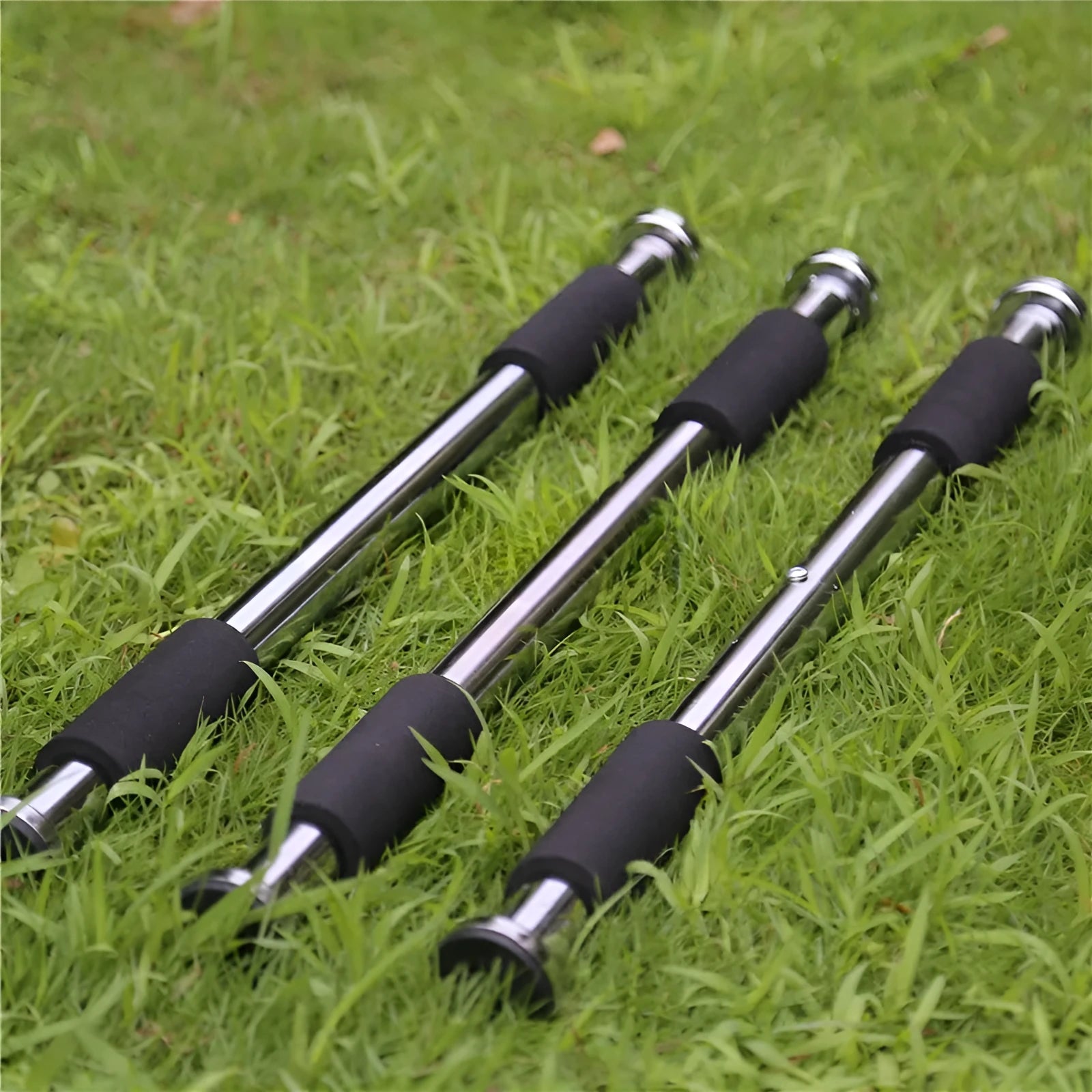 Adjustable steel pull-up bar extended for doorway installation with length markings showing 62cm to 100cm range