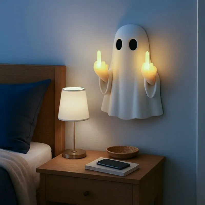 White ghost statue Halloween night lamp with LED lighting on black background