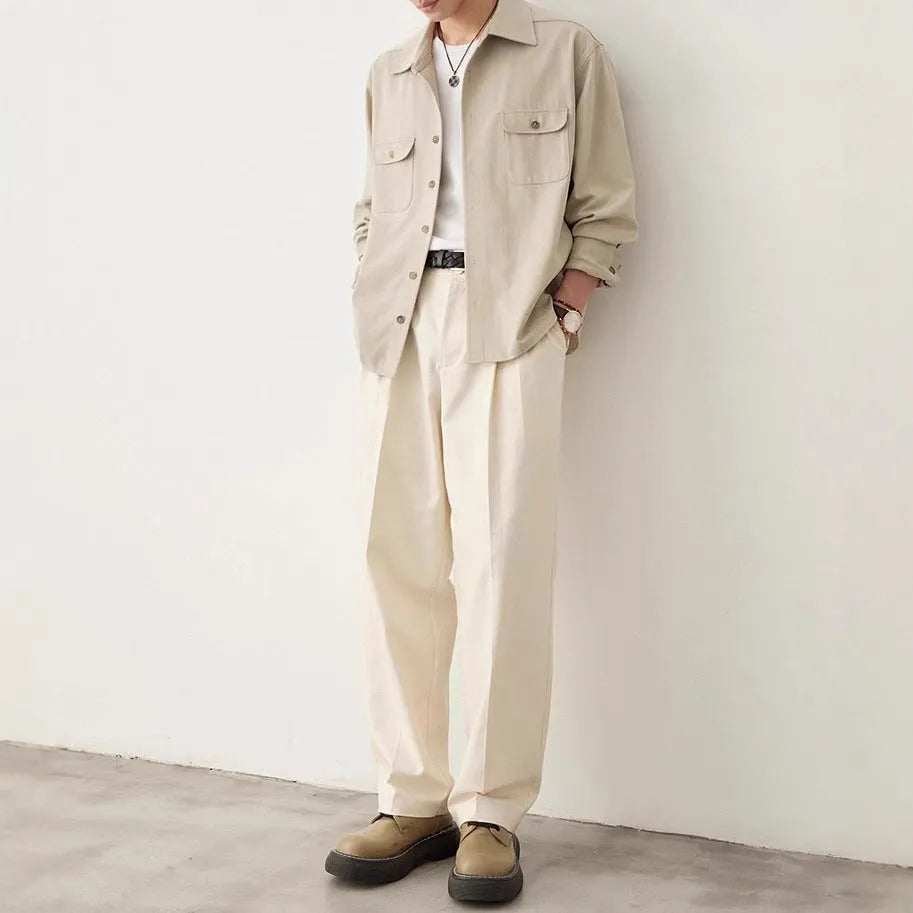 Men's light sand rice coloured cotton blend lapel shirt laid flat, showing long sleeves and simple collar design.