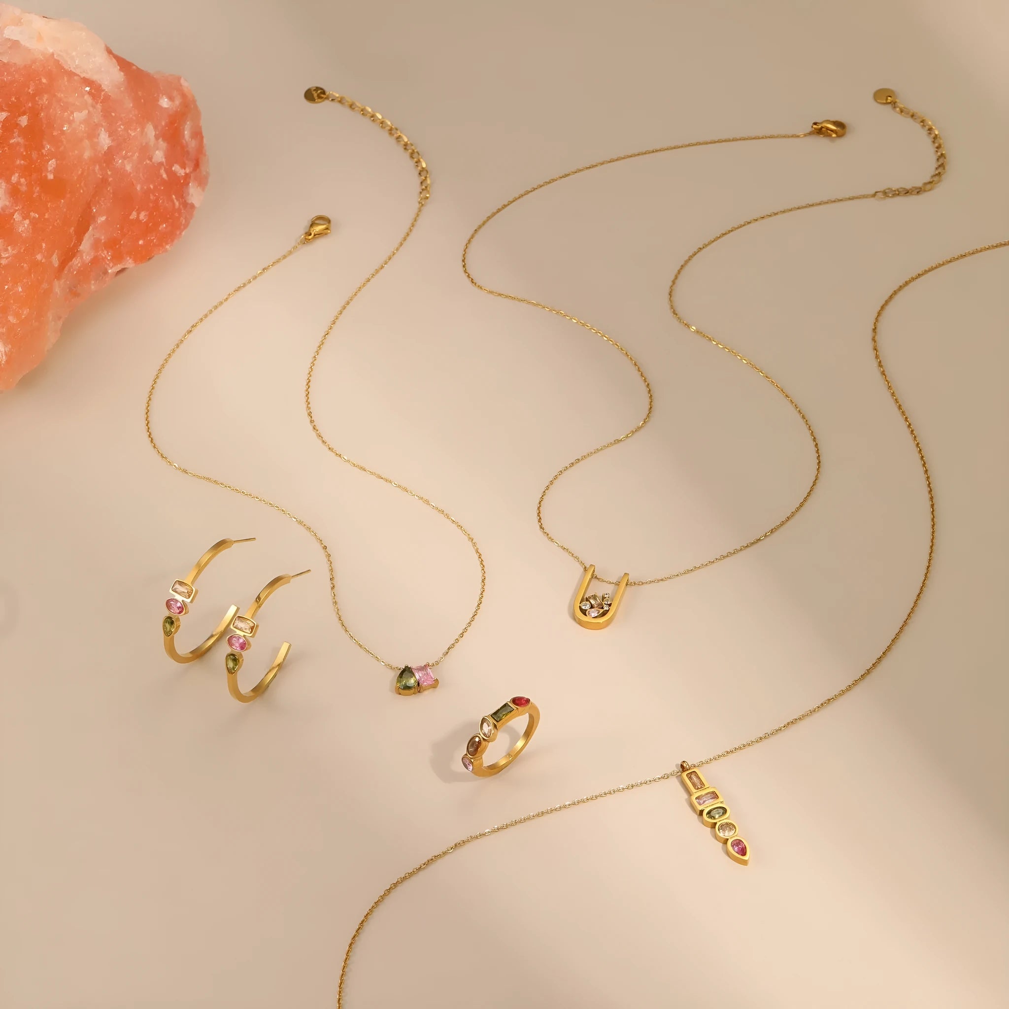Gold plated geometric zircon jewellery set showing necklace, ring and earrings with stainless steel chain
