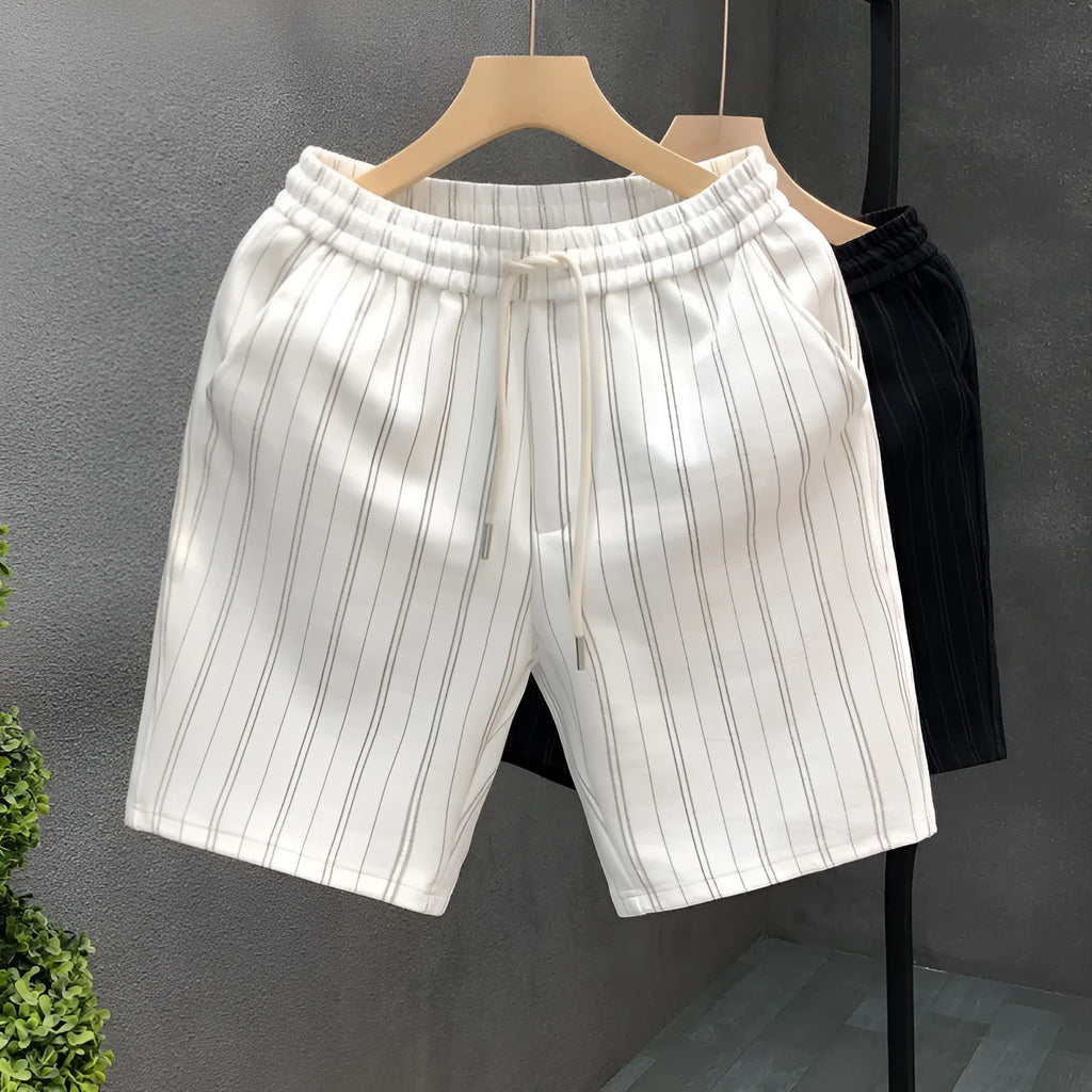 Men's black and white striped fleece-lined casual shorts showing double-layer waistband and straight-leg cut